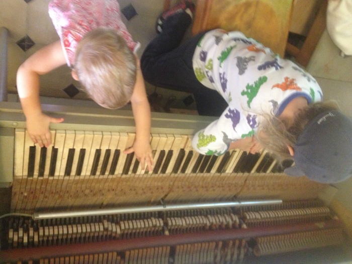 "Serenading" us on the piano.